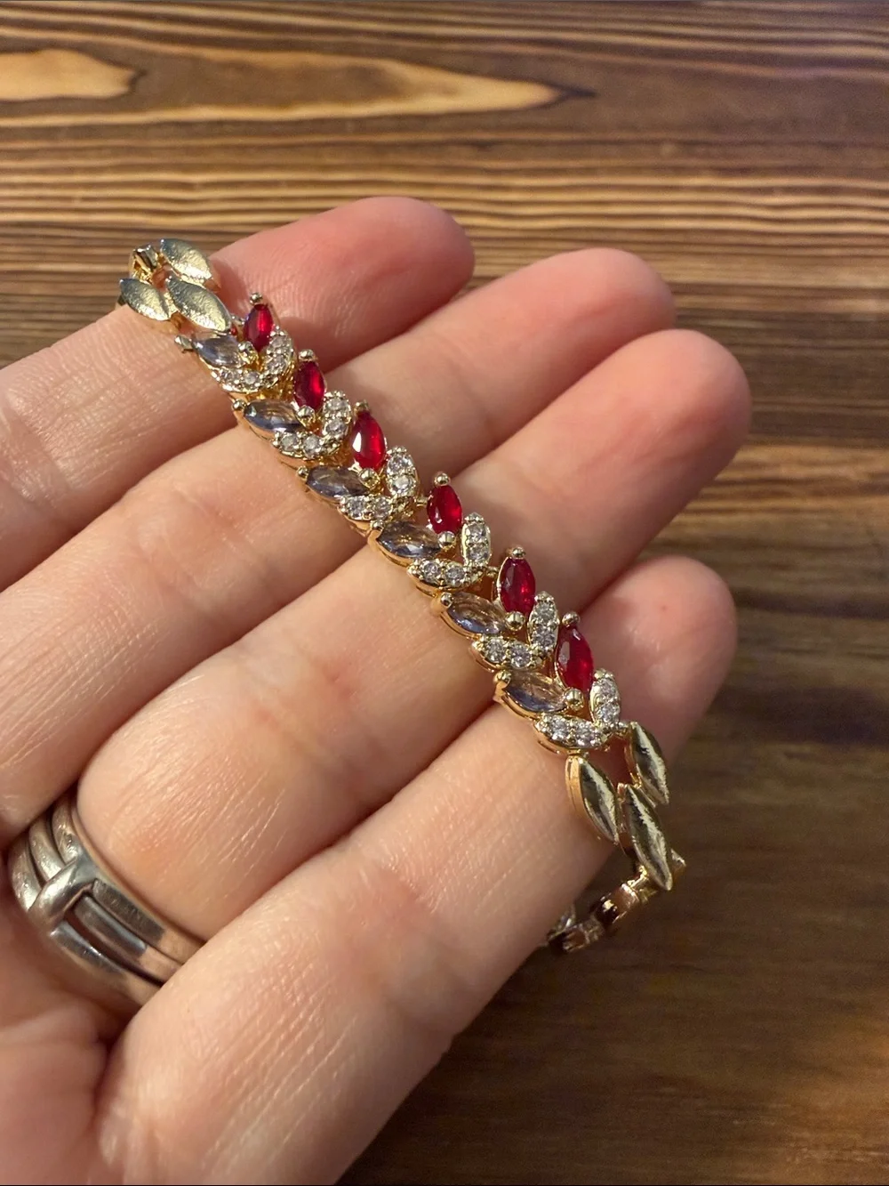 Gold-Tone Bracelet with Red Gem Leaf Accents